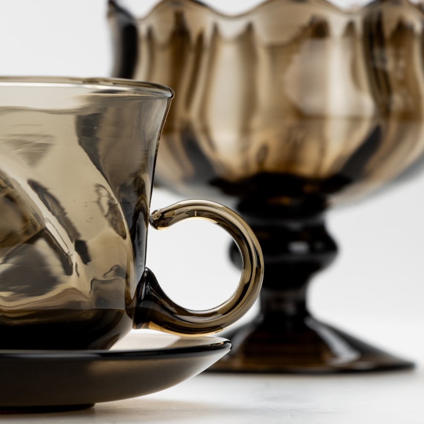 Setti 6x lasikuppia ja aluslautasta sekä 1x savunvärinen sokerikko