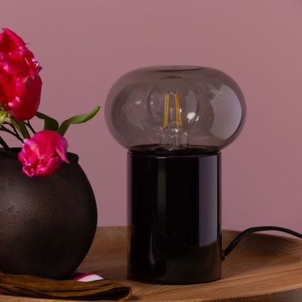 Brilliant - Pöytävalaisin KNUT 1xE27/25W/230V musta/läpinäkyvä