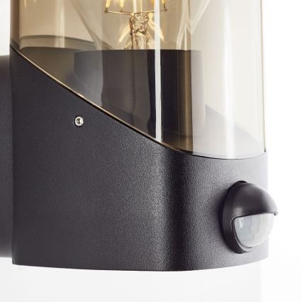 Brilliant - Ulkovalo anturilla MINOU 1xE27/10W/230V IP44 musta/savuinen