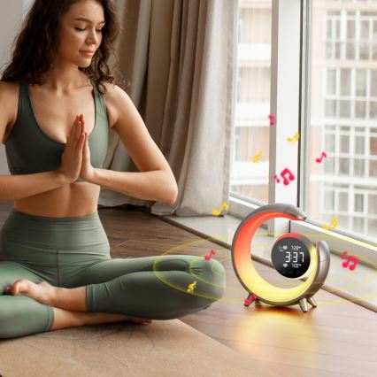 LED RGBW himmennettävä pöytävalaisin herätyskellolla PEACOCK LED/20W/5V USB