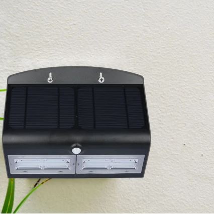 LED aurinkokäyttöinen seinävalaisin sensorilla LED/7W/3,7V 4000K IP65 4000 mAh musta
