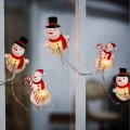 LED jouluketju imukupeilla 6xLED/2xAA 1,2m lämmin valkoinen lumiukko