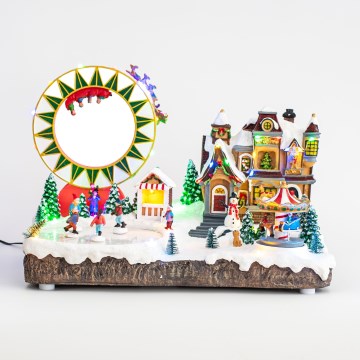 LED RGB Animoituja joulukoristeita musiikin kera 30xLED/1,5W/230V luminen kylä