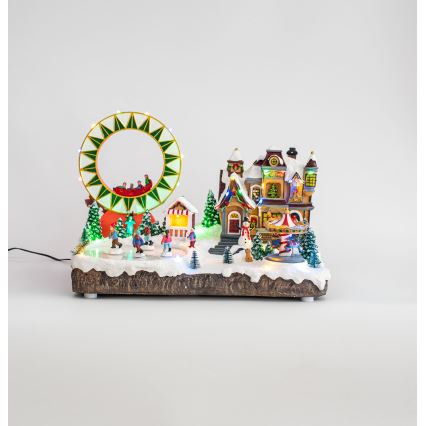 LED RGB Animoituja joulukoristeita musiikin kera 30xLED/1,5W/230V luminen kylä