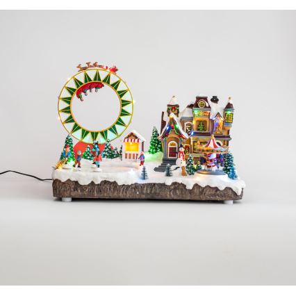 LED RGB Animoituja joulukoristeita musiikin kera 30xLED/1,5W/230V luminen kylä