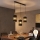 LED-riippuvalaisin vaijerilla BOGART 3xE27/15W/230V musta/kulta