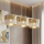 LUX-riippuvalaisin vaijerilla 3xE27/15W/230V valkoinen/kultainen