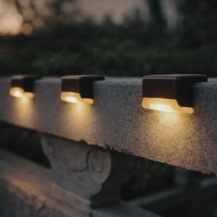 Rabalux - 4 kpl LED-aurinkoseinävalaisinta hämäräkytkimellä LED/0,06W/1,2V 300 mAh IP44