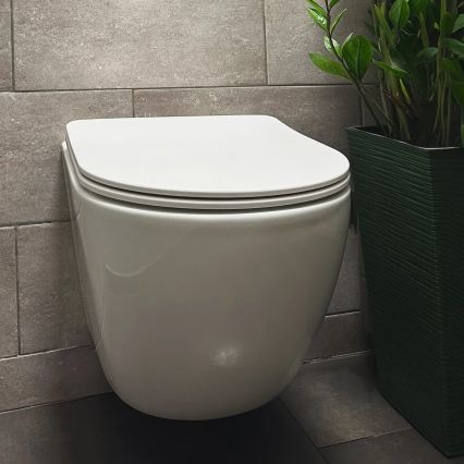 REA-C1259 - Seinään kiinnitettävä WC-istuin istuinkannella CARLO MINI TORNADO RIMLESS, keraaminen/kiiltävän valkoinen