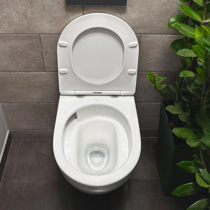 REA-C1259 - Seinään kiinnitettävä WC-istuin istuinkannella CARLO MINI TORNADO RIMLESS, keraaminen/kiiltävän valkoinen