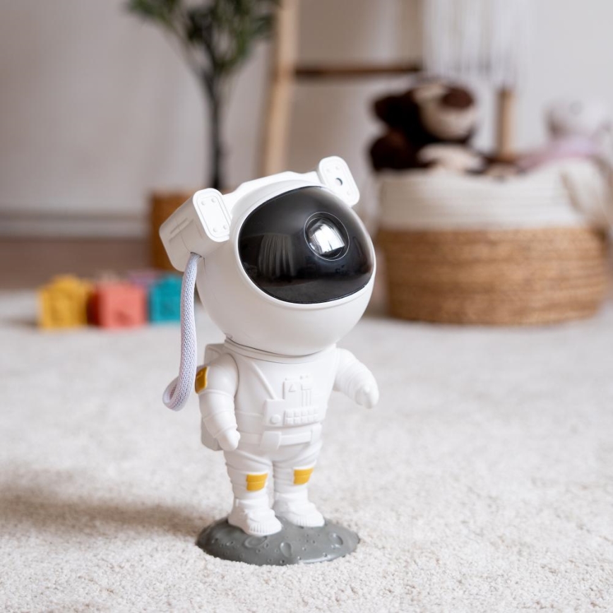 Retlux - LED lastenprojektori 230V astronautti 23,3 cm + kaukosäädin