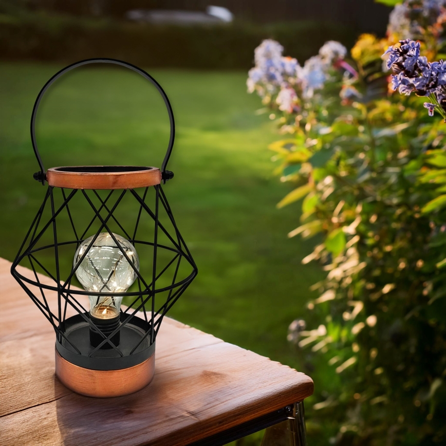 LED Koristeellinen pöytävalaisin LED/3xAA musta/kupari